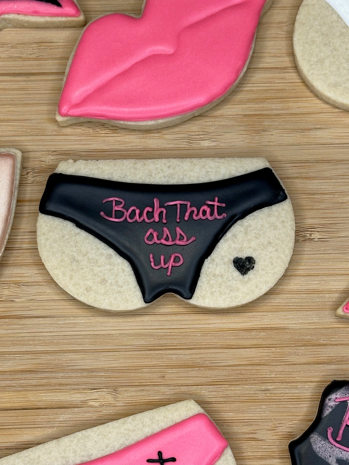 custom bachelorette sugar cookies with pink and black color scheme