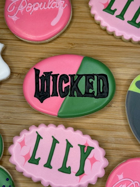 custom birthday sugar cookies in wicked the musical theme