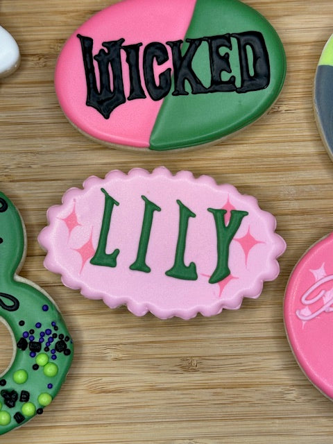custom birthday sugar cookies in wicked the musical theme