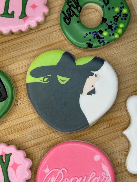 custom birthday sugar cookies in wicked the musical theme